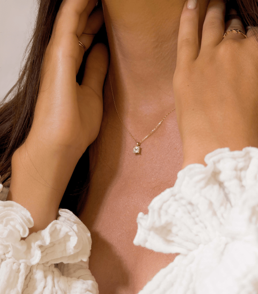 Model Wearing Iman Pendant necklace in 18k Gold Adjustable Length Yellow with Hallmark Stamp Metal One Size 1.8gms