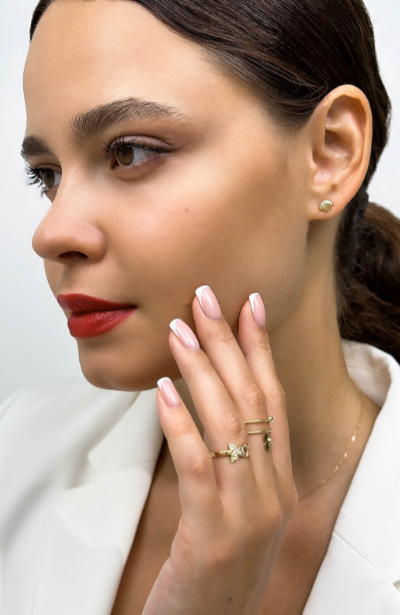 MS Gems by Mamta's commitment to craftsmanship, shown through a jeweler's hands meticulously setting a brilliant-cut diamond in gold.