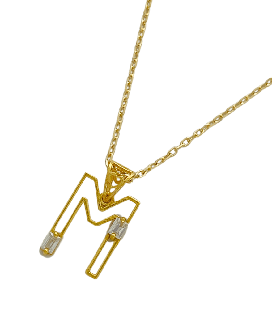 Closeup of Letter 'M' Initials Pendant Necklace in 18k Gold Fixed Length Yellow with Hallmark Stamp Metal One Size 1.3gms