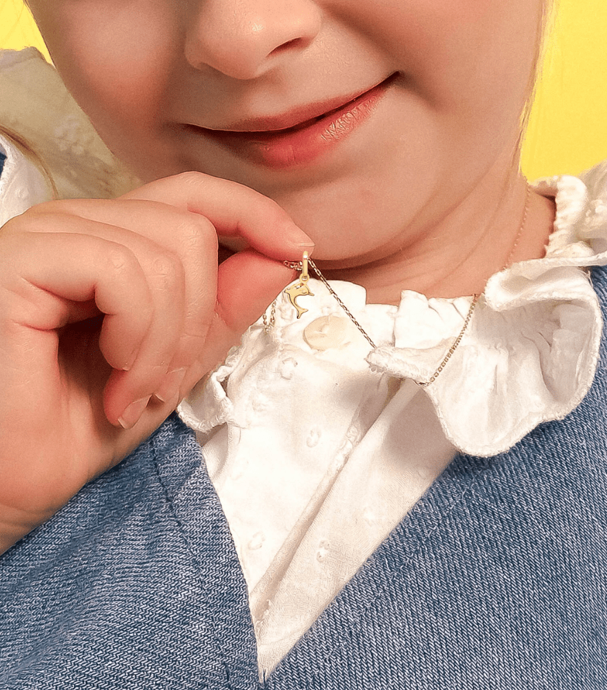 Model Wearing Golden Dolphin charm Pendant Necklace in 18k Gold Adjustable Length Yellow with Hallmark Stamp Metal One Size 1.6gms