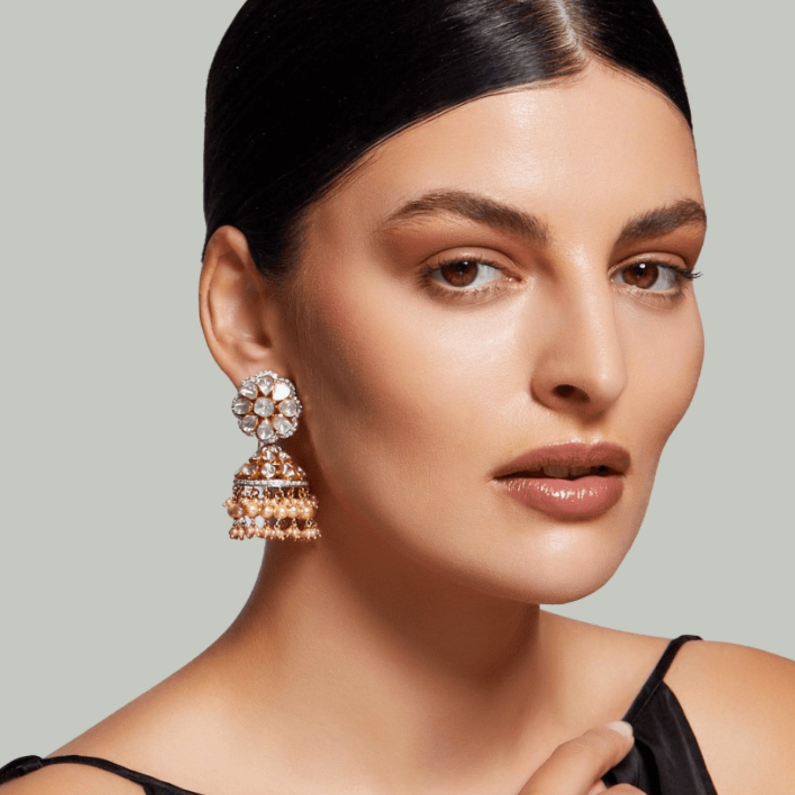 Women Wearing Classic diamond stud earrings from the MS Gems by Mamta Timeless Collection, symbolizing enduring elegance and style.