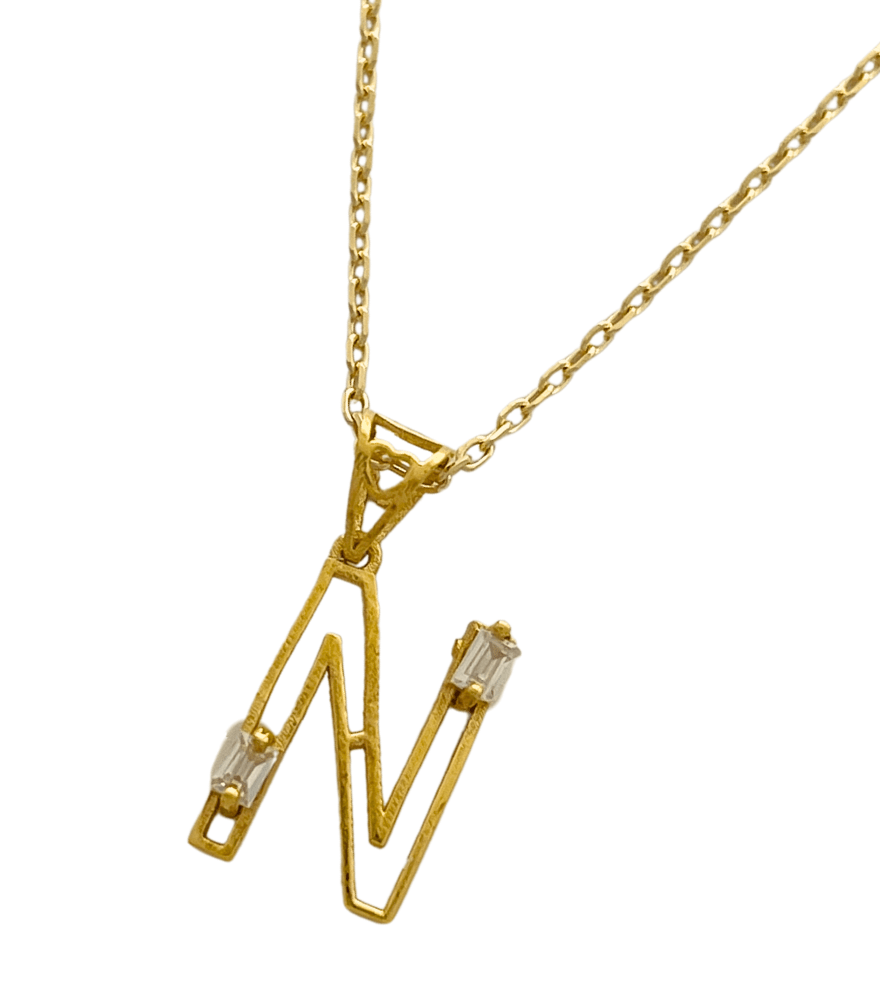 Closeup of Letter 'N' Initials Pendant Necklace in 18k Gold Fixed Length Yellow with Hallmark Stamp Metal One Size 1.3gms