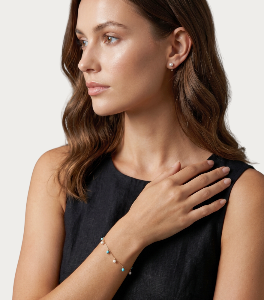 Model Wearing Aqua turquoise and pearl Bracelet in 18K Gold Adjustable Length 18k Yellow with Hallmark Stamp Metal 7 inches 1gms